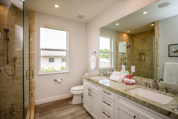 Spacious Bathroom With Custom Cabinetry and Tile Floor