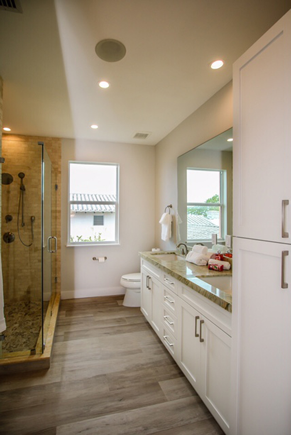 Bathroom with the glass door and cabinet