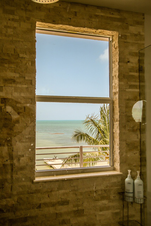 View of tropical beach from the window of lighting room